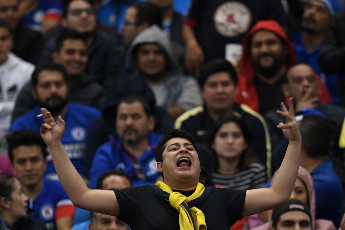 America's fans react during the 2018 Mexican Apertura tournament football final match against Cruz Azul at the Azteca stadium in Mexico City, on December 16, 2018. - America won the 2018 Mexican Apertura tournament on Sunday with a 2-0 win over Cruz Azul in the second leg of the final played at the Azteca Stadium.