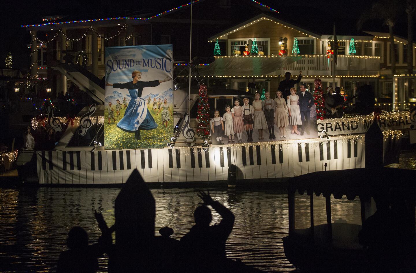 The Grand Marshal’s boat is decorated with a “Sound of Music” theme during the 54th annual Huntington Harbour Boat Parade in Huntington Beach on Saturday.