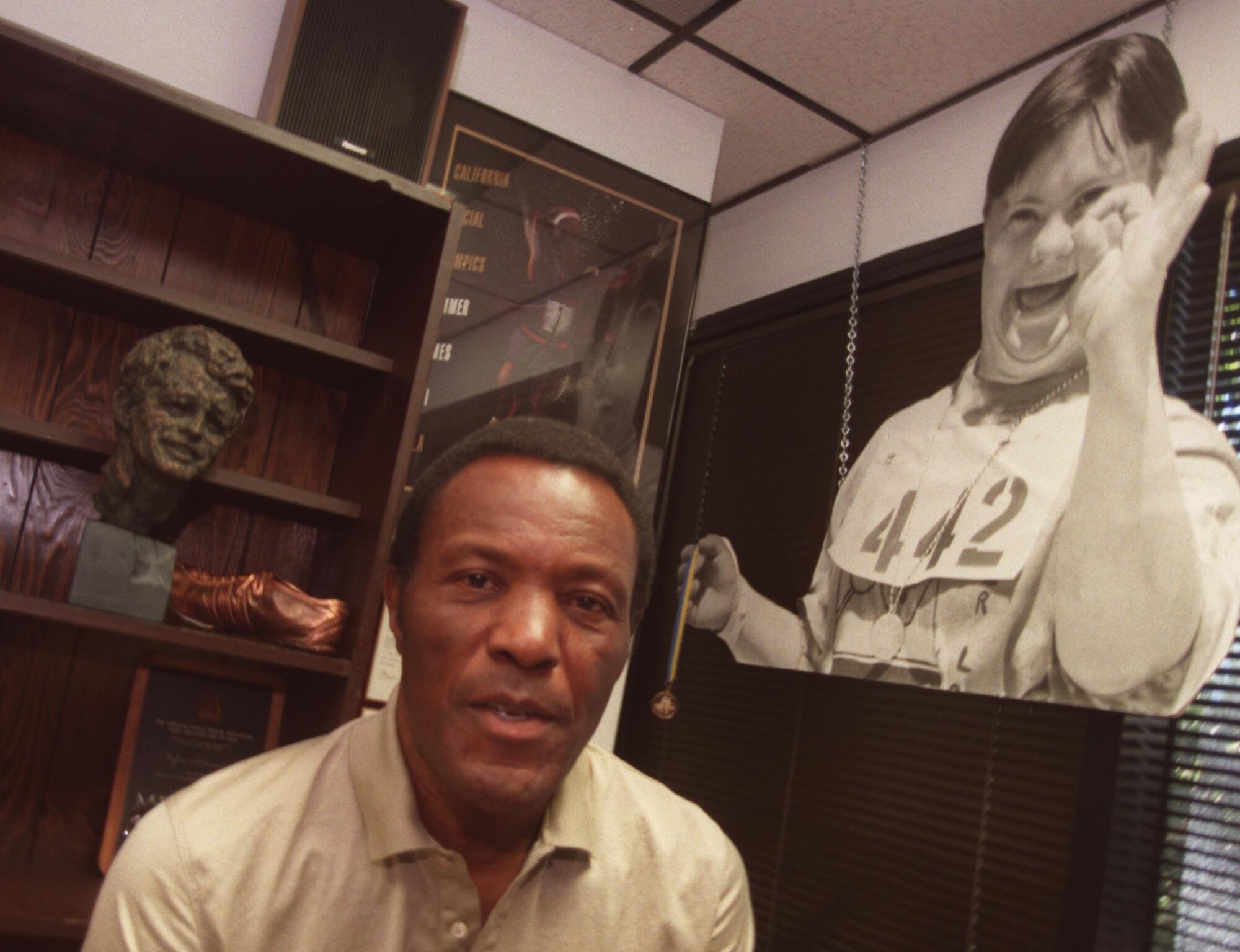 Rafer Johnson works as a volunteer for the Special Olympics in his office in Culver City.