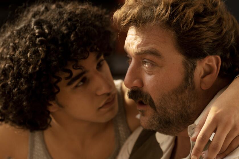 Khalil Gharbia, left, and Denis Ménochet in the movie "Peter von Kant."