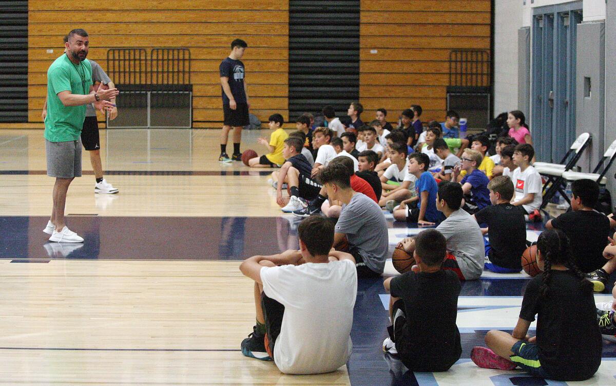 Crescenta Valley High School head boys' basketball coach Shawn Zargarian assigns his basketball campers to their next drill at the Coach Z Basketball Camp at Crescenta Valley High School on Monday, July 22, 2019. Coach Shawn Zargarian coordinated basketball drills with helping coaches to keep about 50 youth basketball enthusiasts busy.