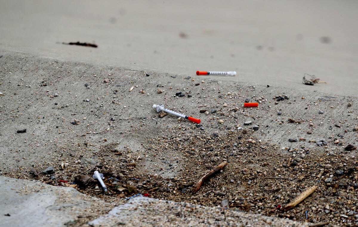 Syringes dot the banks of the Santa Ana River in 2017.