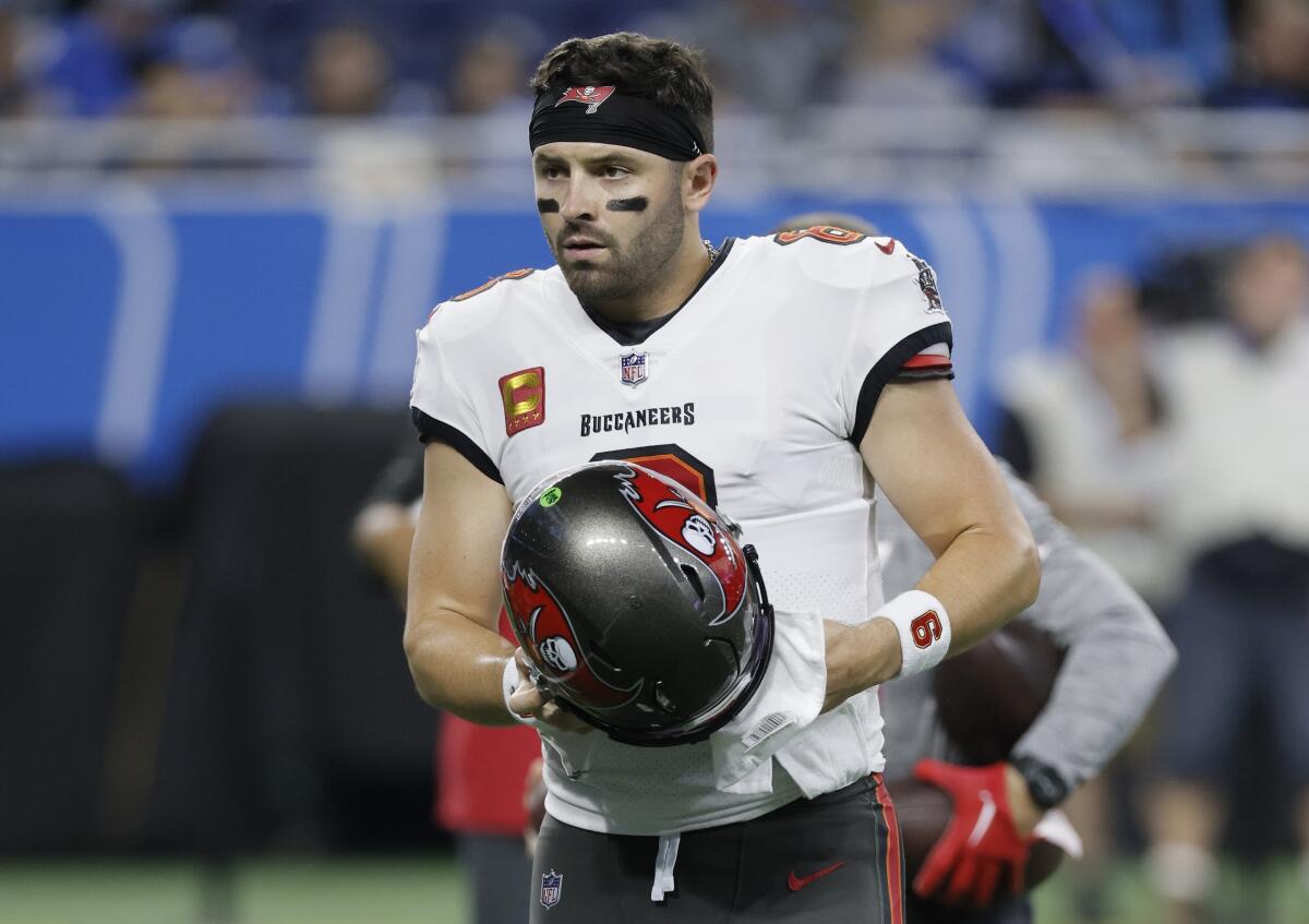 Tampa Bay Buccaneers quarterback Baker Mayfield (6) takes off his helmet