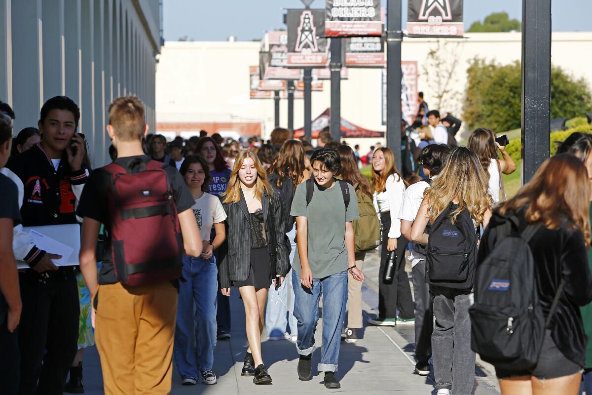 Students head to class during the first day of school at Huntington Beach High on Wednesday.