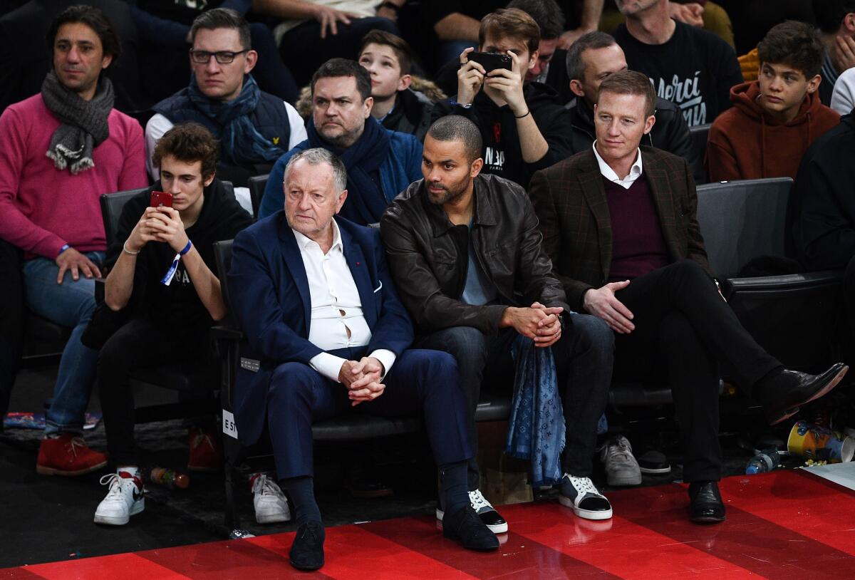 At second from right, Tony Parker, a former star with the San Antonio Spurs, follows the game Jan. 24, 2020, in Paris.