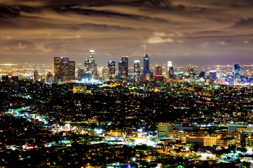 A view over the Los Angeles skyline at dusk/evening.