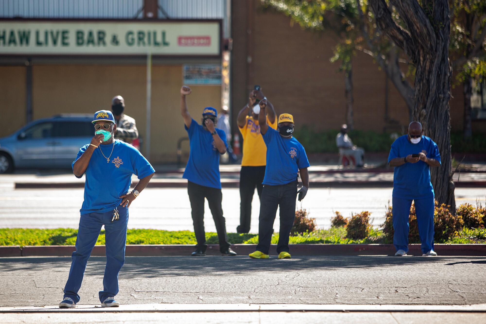 Members of Crenshaw High School's class of 1973 gather outside Jackson's funeral.