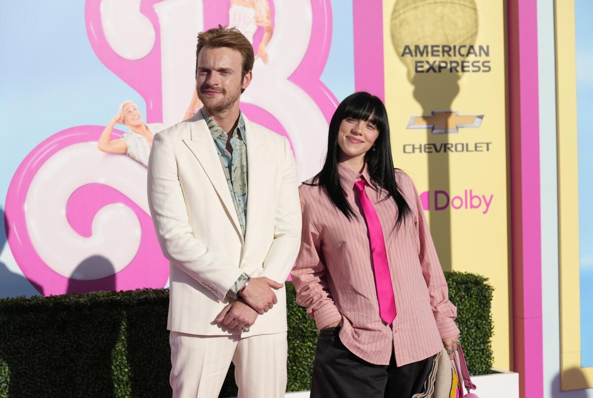 Finneas and Billie Eilish arrive at the pink-carpet premiere of the 'Barbie' movie.