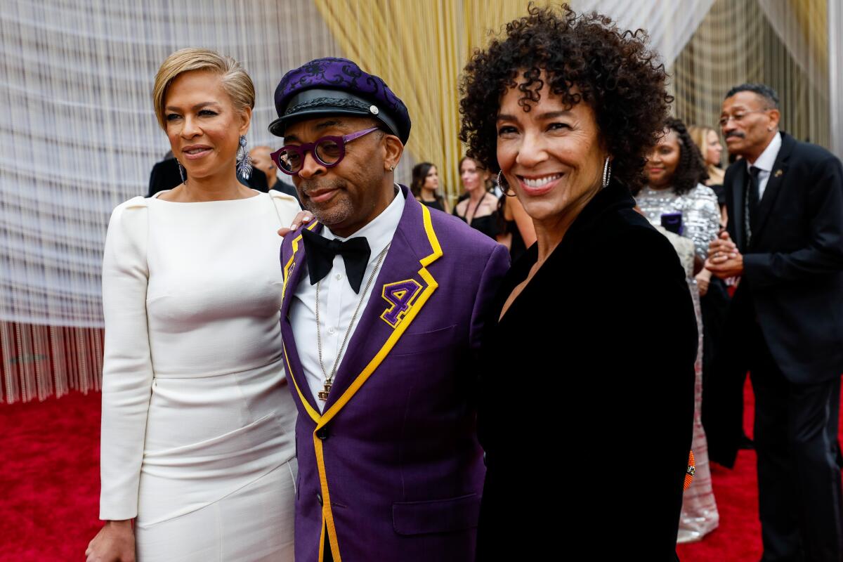 Tonya Lewis Lee, left, and Spike Lee, center, arriving at the 92nd Academy Awards.