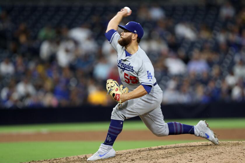 SAN DIEGO, CALIFORNIA - AUGUST 27: Russell Martin #55 of the Los Angeles Dodgers pitches during the ninth inning of a game against the San Diego Padresat PETCO Park on August 27, 2019 in San Diego, California. (Photo by Sean M. Haffey/Getty Images) ** OUTS - ELSENT, FPG, CM - OUTS * NM, PH, VA if sourced by CT, LA or MoD **