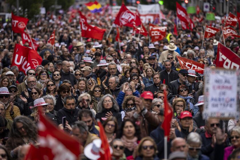 Demonstrators attend a May Day rally in Madrid, Wednesday, May 1, 2024. (AP Photo/Bernat Armangue)