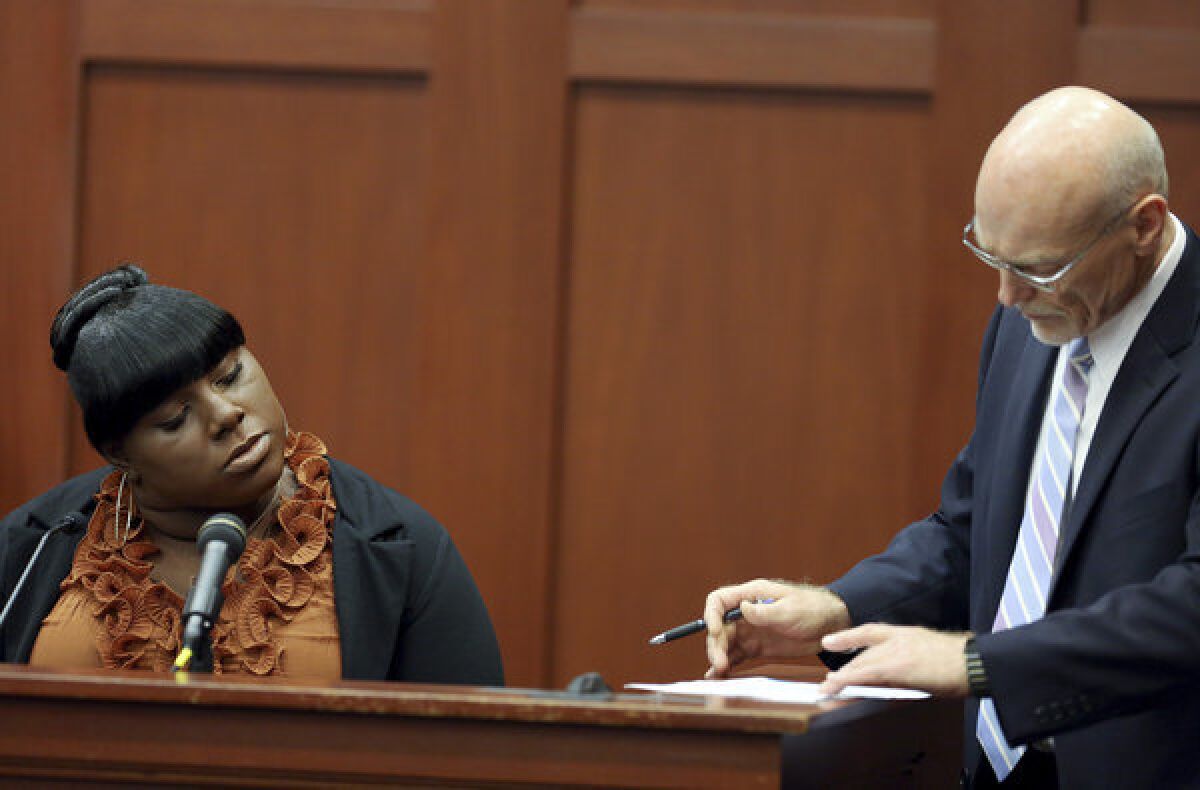Witness Rachel Jeantel, left, continues her testimony to defense attorney Don West at George Zimmerman's murder trial in Sanford, Fla., on Thursday.