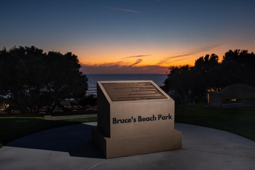 Manhattan Beach, CA - March 18:The new monument at Bruce's Beach Park that acknowledges and condemns the historical injustices of Bruce's Beach at 26th Street and Highland Avenue, in Manhattan Beach, CA, Monday, March 27, 2023. During a ceremony unveiling the new monument on Sat. March 18th, Manhattan Beach Mayor Steve Napolitano personally apologized for the historical injustices and urged the city's Council to officially do the same. Some of the land making up Bruce's Beach was purchased by African American couple Willa and Charles Bruce, in 1912, establishing a resort that was open to African Americans. But by the 1920s, racial tensions grew in the beach community and the city condemned the properties. The park was renamed multiple times over the next 80 years and in 2007, was re-named for the Bruce family, responsible for trying to bring change and equality to the city. (Jay L. Clendenin / Los Angeles Times)