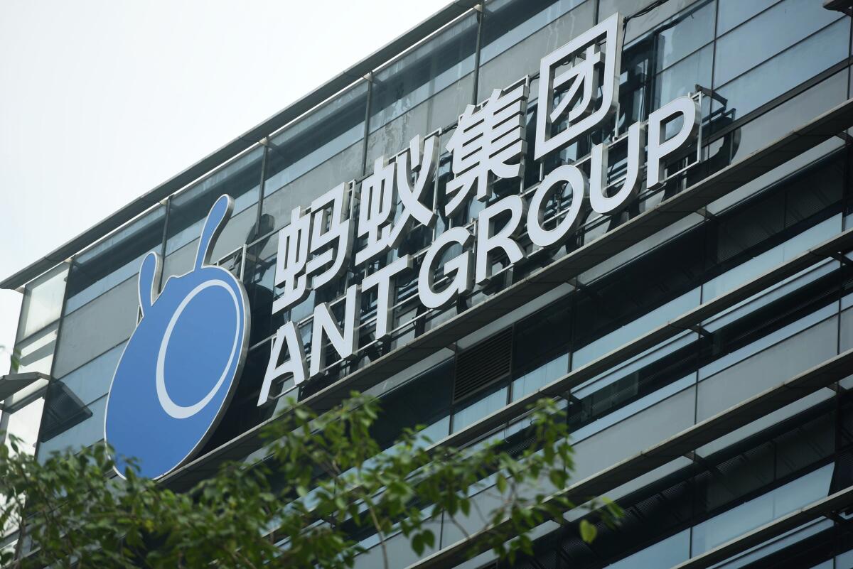 FILE - In this Oct. 26, 2020, file photo, a view of the signage of Ant Group is seen at the headquarters compound of the fintech giant in Hangzhou in eastern China's Zhejiang province. The CEO of Ant Group, the world’s biggest financial technology company, has resigned from the company due to personal reasons. Ant Group thanked Simon Hu on Friday, March 12, 2021, for his contributions to the business. He had served as CEO since 2019. (Chinatopix Via AP, File)