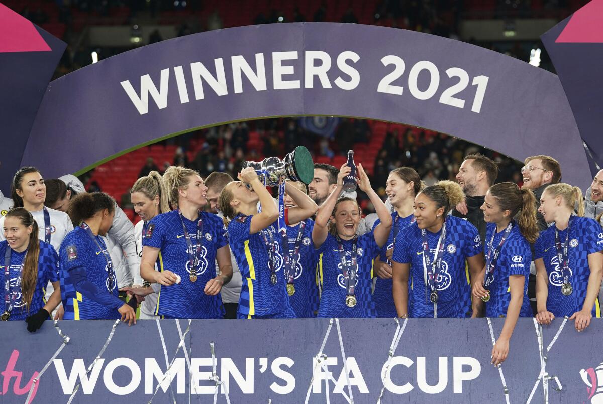 Chelsea players celebrate with the trophy after the women's FA Cup final 