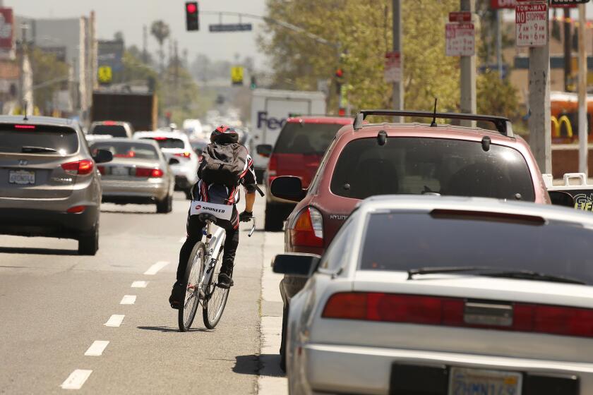 LOS ANGELES, CA - APRIL 23, 2019 - Speed feedback signs have been installed on a 1-mile stretch of Manchester Avenue between Vermont and Western considered one of the deadliest streets in the city for pedestrians and bicyclists. The move including more visible crosswalks, yellow pedestrian yield signs at crossings are supposed to cut down on deaths as part of the city's Vision Zero program. (Al Seib / Los Angeles Times)