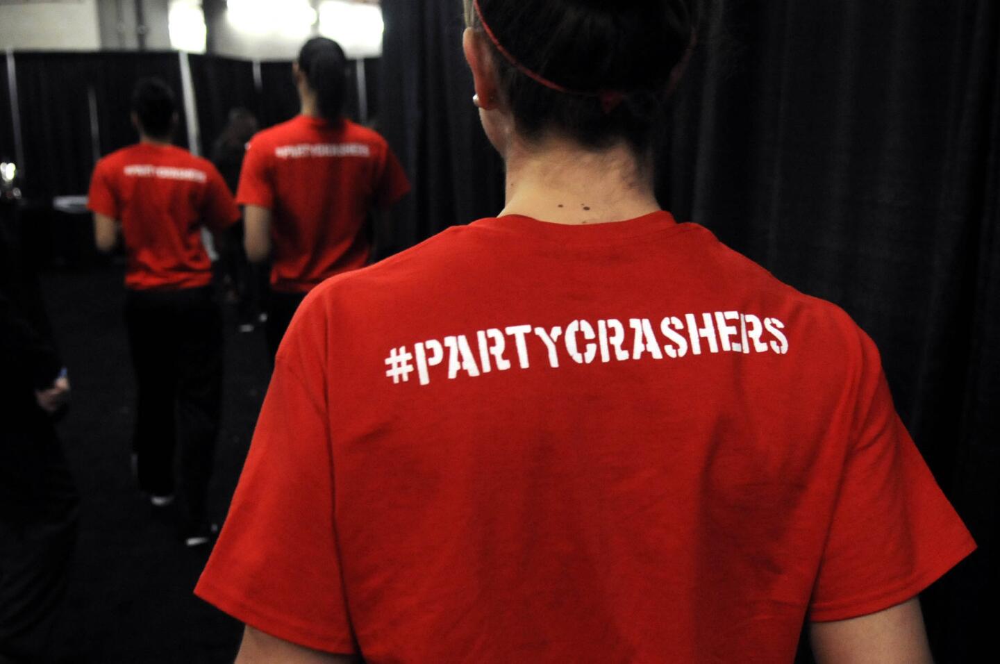The Louisville women's team wear tee shirts with the hashtag Partycrashers on the back during press conferences at the New Orleans Arena Monday.