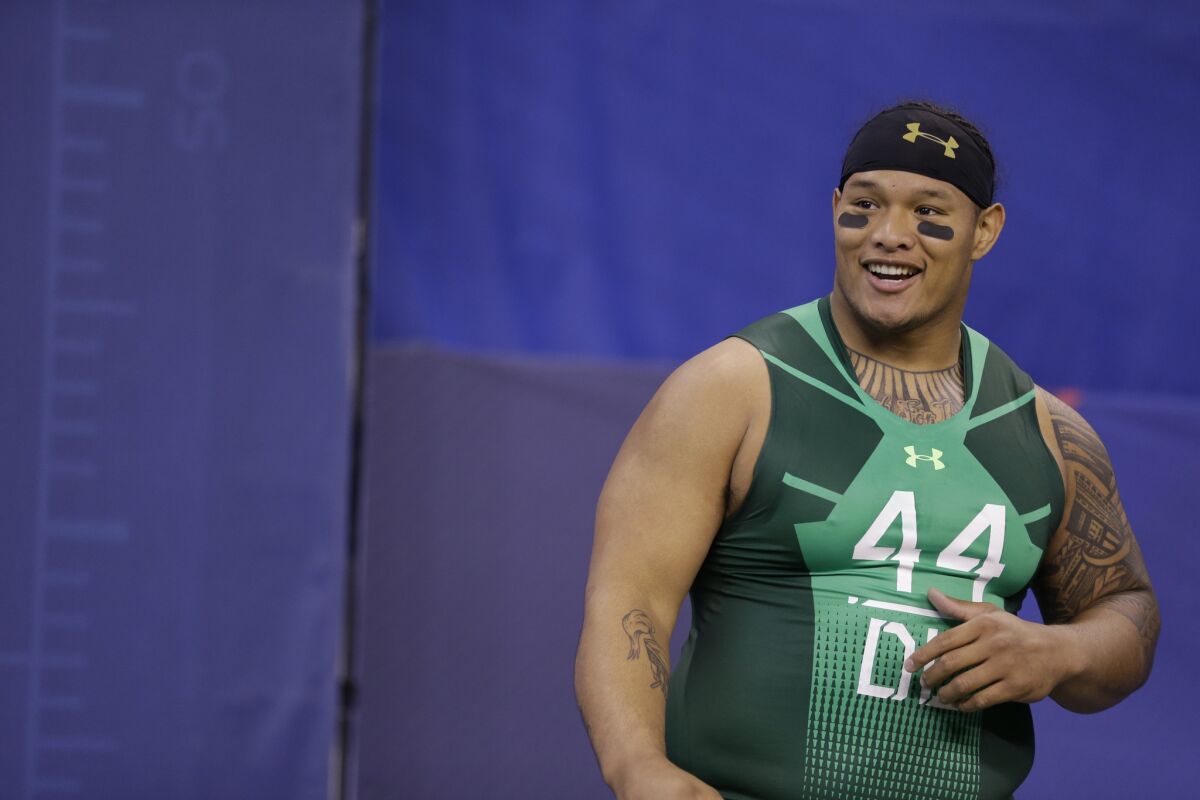 Washington defensive lineman Danny Shelton smiles during a break between drills at the NFL scouting combine in Indianapolis on Feb. 22.