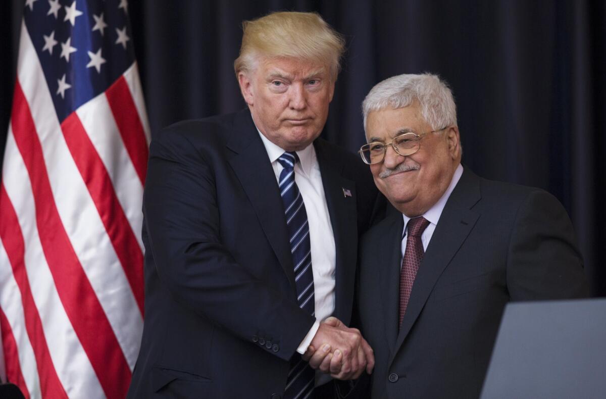 President Trump shakes hands with Palestinian President Mahmoud Abbas after they held a joint press conference at Abbas' residence in Bethlehem, the West Bank on May 23, 2017.
