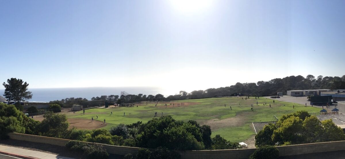 The Del Mar Heights field in use by football and baseball teams on a weekday afternoon.