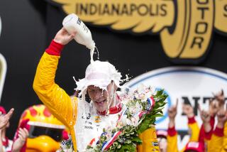 Josef Newgarden celebrates after winning the Indianapolis 500 auto race at Indianapolis Motor Speedway.