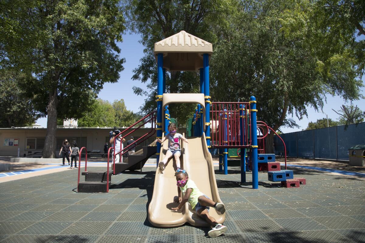 Students play on the playground at Hamlin Charter Academy in West Hills on May 3, 2021.