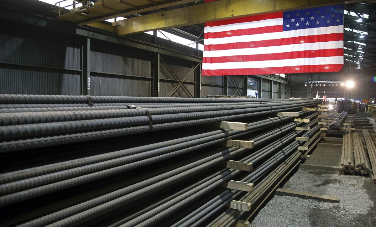 FILE - In this May 9, 2019, photo, steel rods produced at the Gerdau Ameristeel mill in St. Paul, Minn. await shipment. The United States and the United Kingdom have agreed to begin talks on removing former President Donald Trump's import taxes on British steel and aluminum. In a joint statement Wednesday, Jan. 19, 2022 U.S. Commerce Secretary Gina Raimondo, U.S. Trade Representative Katherine Tai and U.K. Trade Minister Anne-Marie Tevelyan said they would be working toward a swift deal that ensures the viability of the steel and aluminum industries in both countries and also “strengthens their democratic alliance.'' (AP Photo/Jim Mone, File)