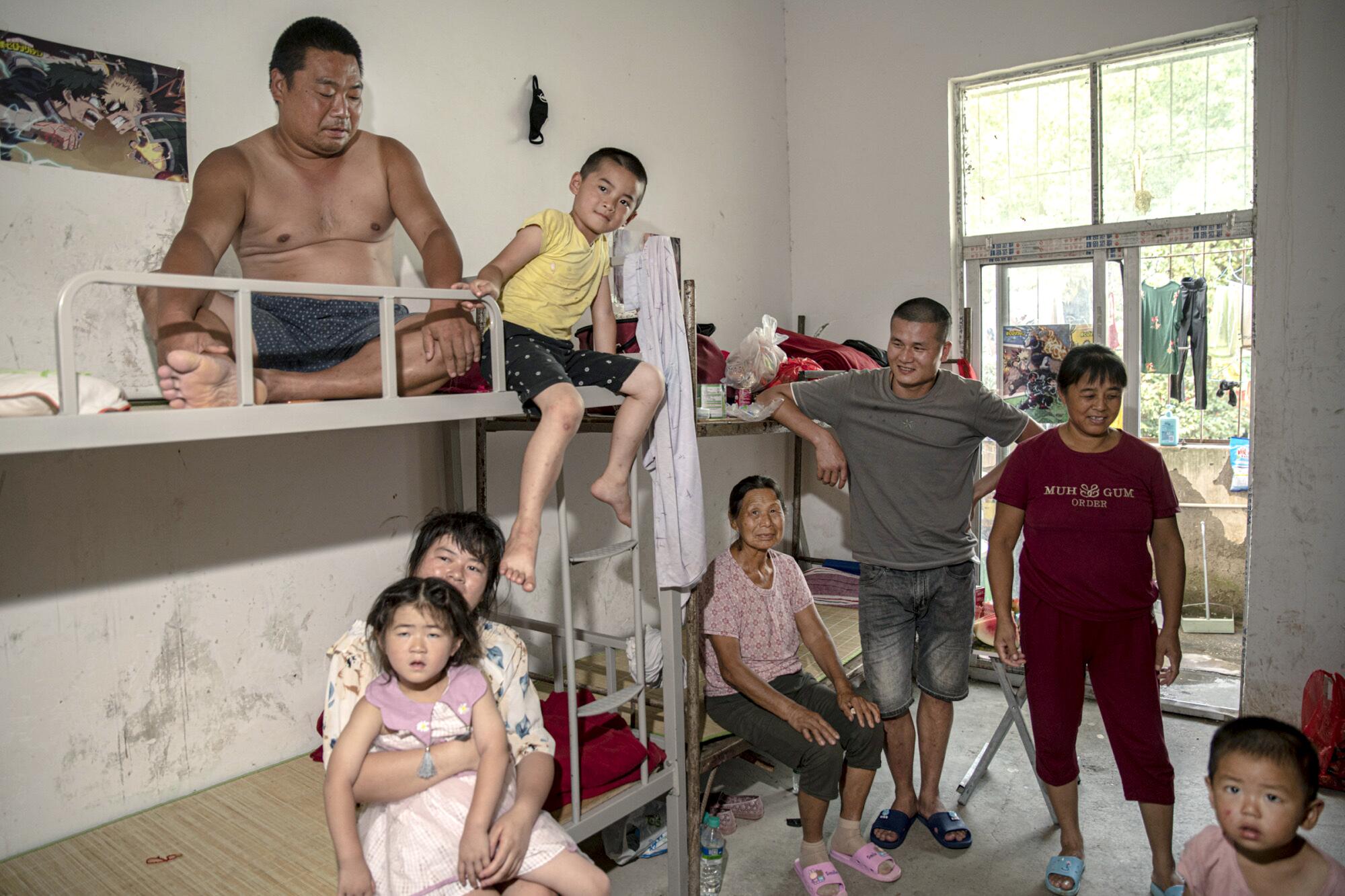 The Huang family, displaced from their village because of the floods.