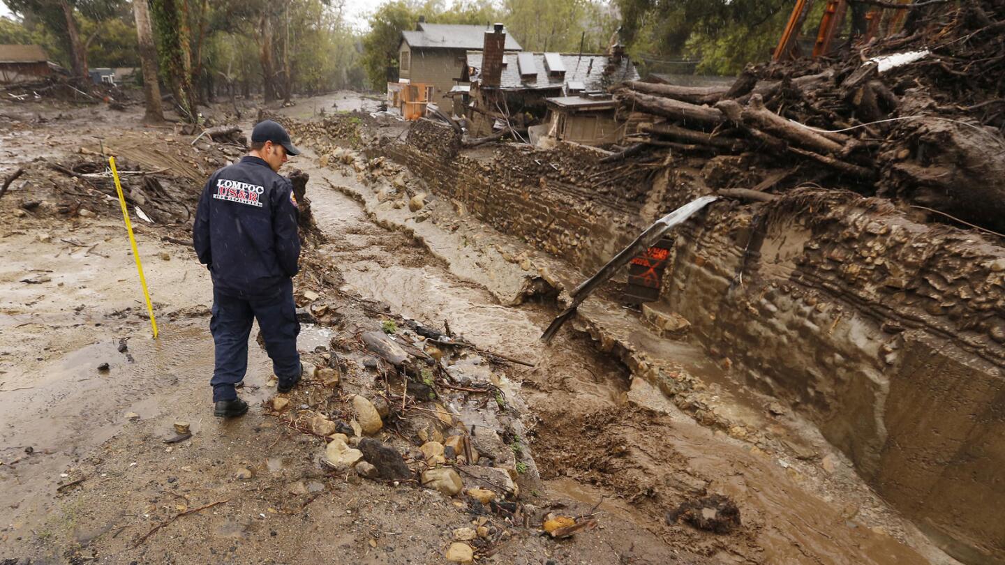 Lompoc Firefighter Chris Martinez scouts Montecito Creek at the East Valley Road crossing near Parra Grande Lane on Wednesday March 21, 2018.