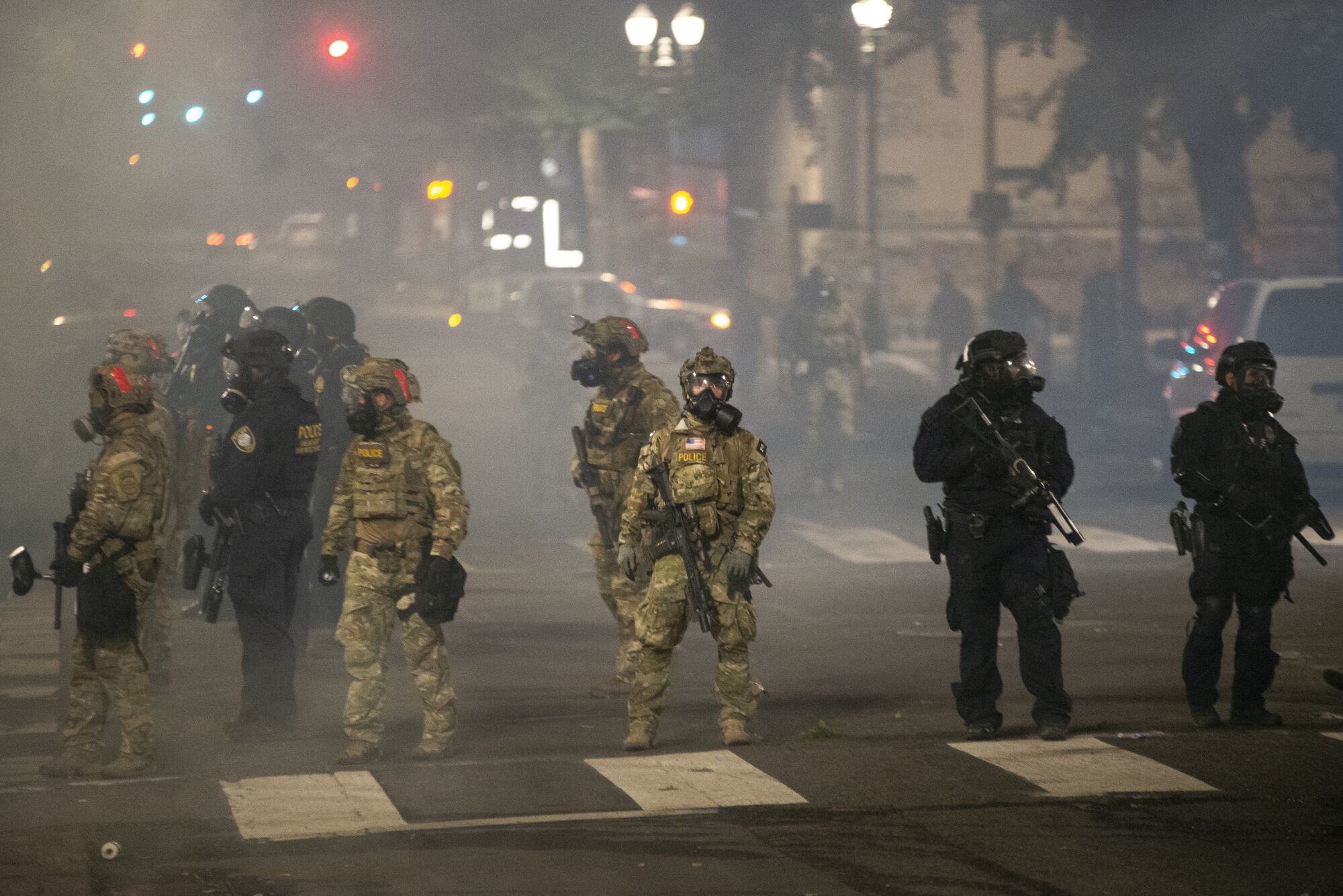 Federal officers stand guard.
