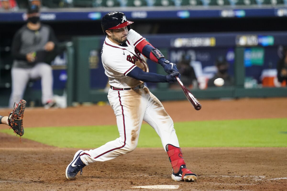 Atlanta Braves' Travis d'Arnaud hits a three-run home run.