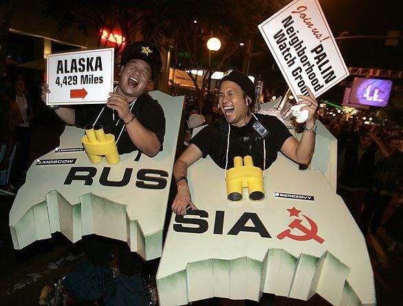 Two "Russian" Halloween revelers, Stanton Wong, left, and Glenn Yee, party on Santa Monica Boulevard during the annual West Hollywood Costume Carnaval.