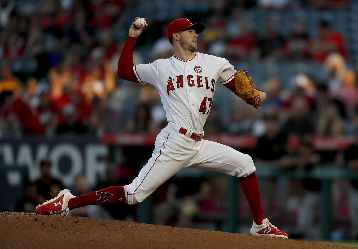Angels starter Griffin Canning delivers a pitch against the Pittsburgh Pirates in the first inning on Aug. 13, 2019, at Angel Stadium.