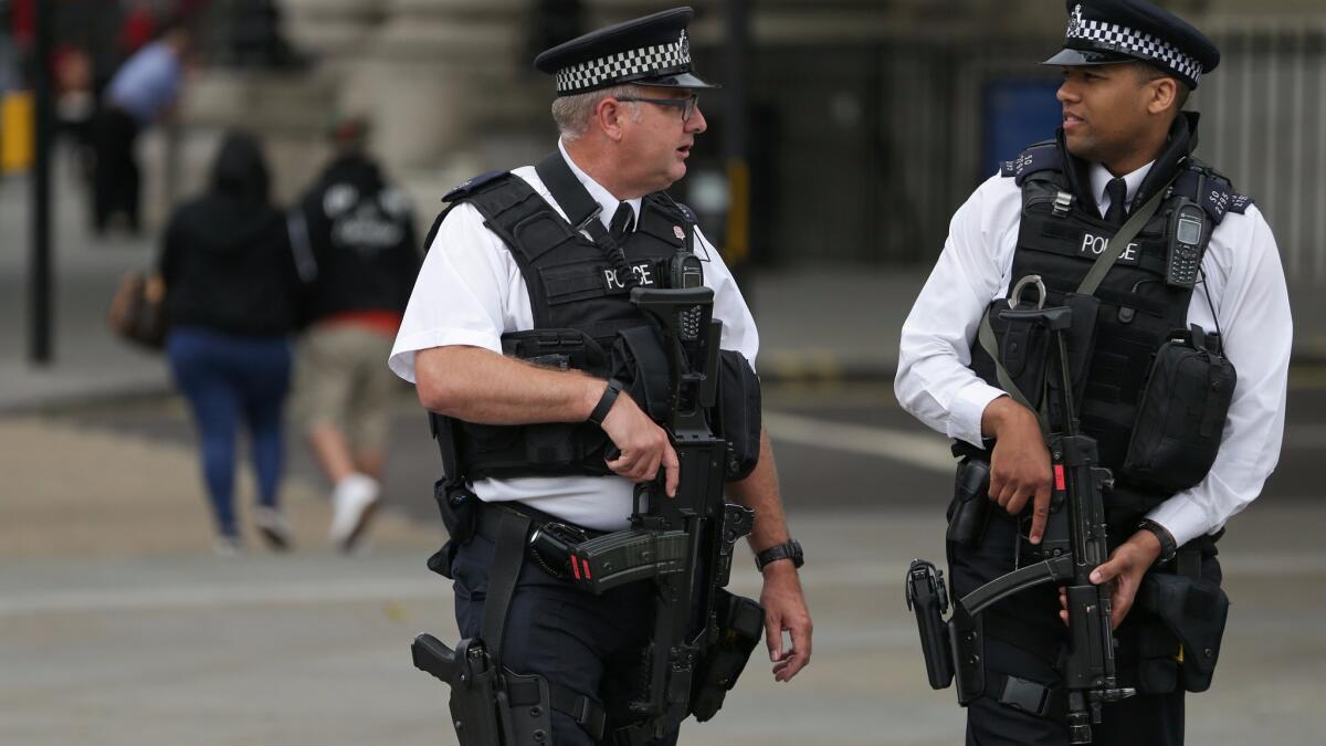 Armed police officers patrol London's Trafalgar Square after an overnight knife attack in Russell Square.