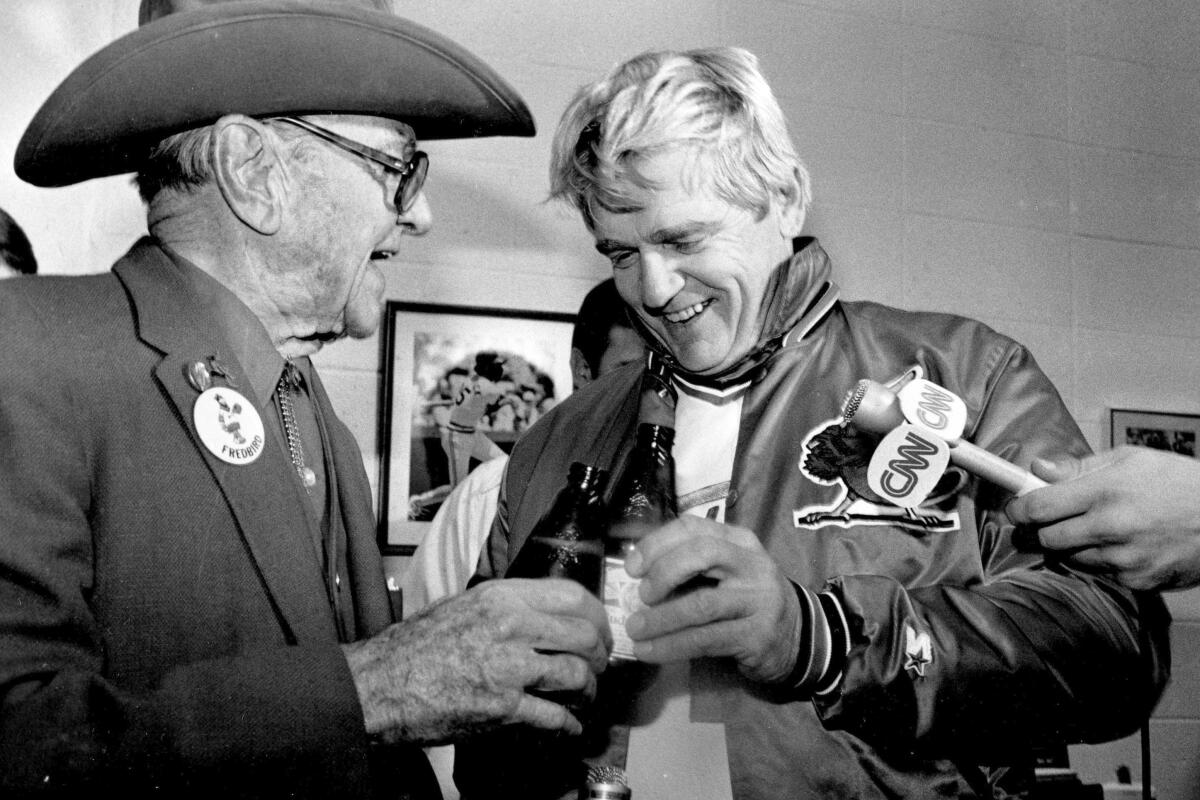 Cardinals manager Whitey Herzog, right, toasts with owner August "Gussie" Busch Jr., after winning the World Series in 1982.