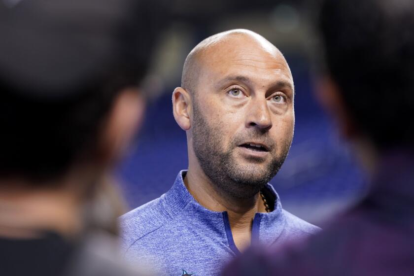 FILE - Derek Jeter, CEO of the Miami Marlins, speaks with the news media before a baseball game against the Philadelphia Phillies, Saturday, Oct. 2, 2021, in Miami. Derek Jeter announced a surprise departure from the Miami Marlins Monday, Feb. 28, 2022, after four mostly unsuccessful that didn't come close to matching his success as a player for the New York Yankees.(AP Photo/Lynne Sladky, File)