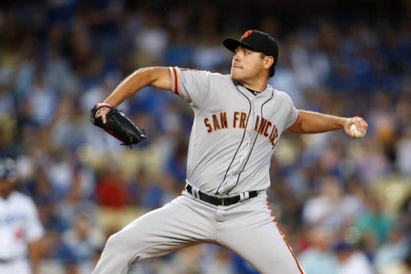 Giants left-hander Matt Moore pitches against the Dodgers during a game on Aug. 25 at Dodger Stadium.