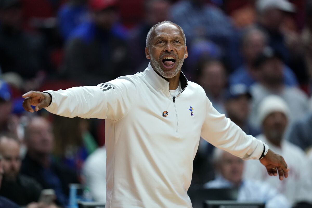 Kansas acting coach Norm Roberts, filling in for an ailing Bill Self, directs the Jayhawks during the first half.