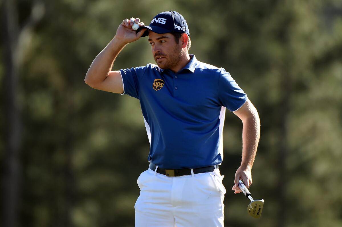 Louis Oosthuizen reacts after finishing on the 18th green during the final round of the 2016 Masters Tournament at Augusta National Golf Club.