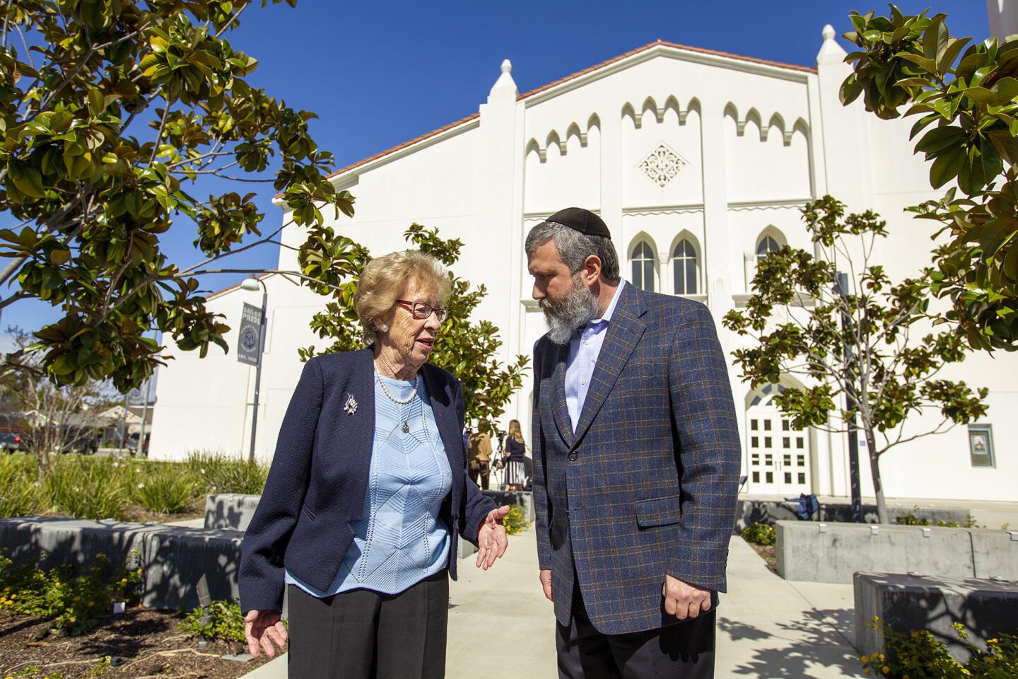 Eva Schloss, 89, a Holocaust survivor and Anne Frank's stepsister, speaks with Chabab Rabbi Reuven Mintz during a press conference at Newport Harbor High school on Thursday, March 7. Schloss met and talked with students invoived in a party made Nazi salutes around a Swastika that made of red cups during an off-campus party last week.