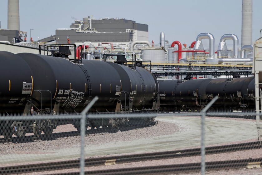 FILE - In this April 21, 2020 file photo, ethanol train cars wait outside the Southwest Iowa Renewable Energy plant, an ethanol producer, in Council Bluffs, Iowa. A federal appeals court on Friday, July 2, 2021, threw out a Trump-era Environmental Protection Agency rule change that allowed for the sale of a 15% ethanol gasoline blend in the summer months. (AP Photo/Nati Harnik, File)