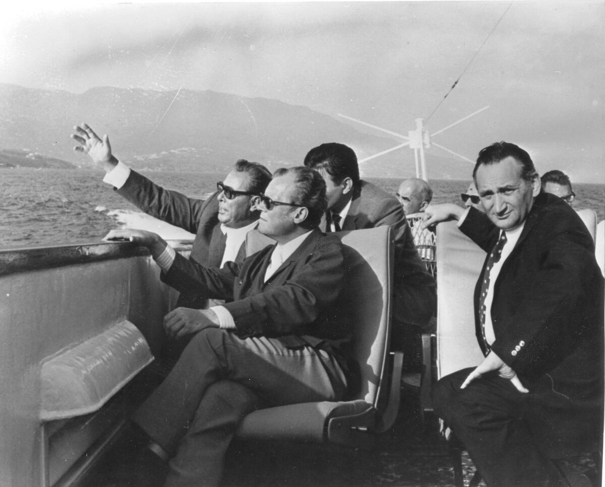 A 1971 photo shows Egon Bahr, at right, with Soviet party chairman Leonid Brezhnev, left, and West German Chancellor Willy Brandt during a boat ride on the Black Sea.