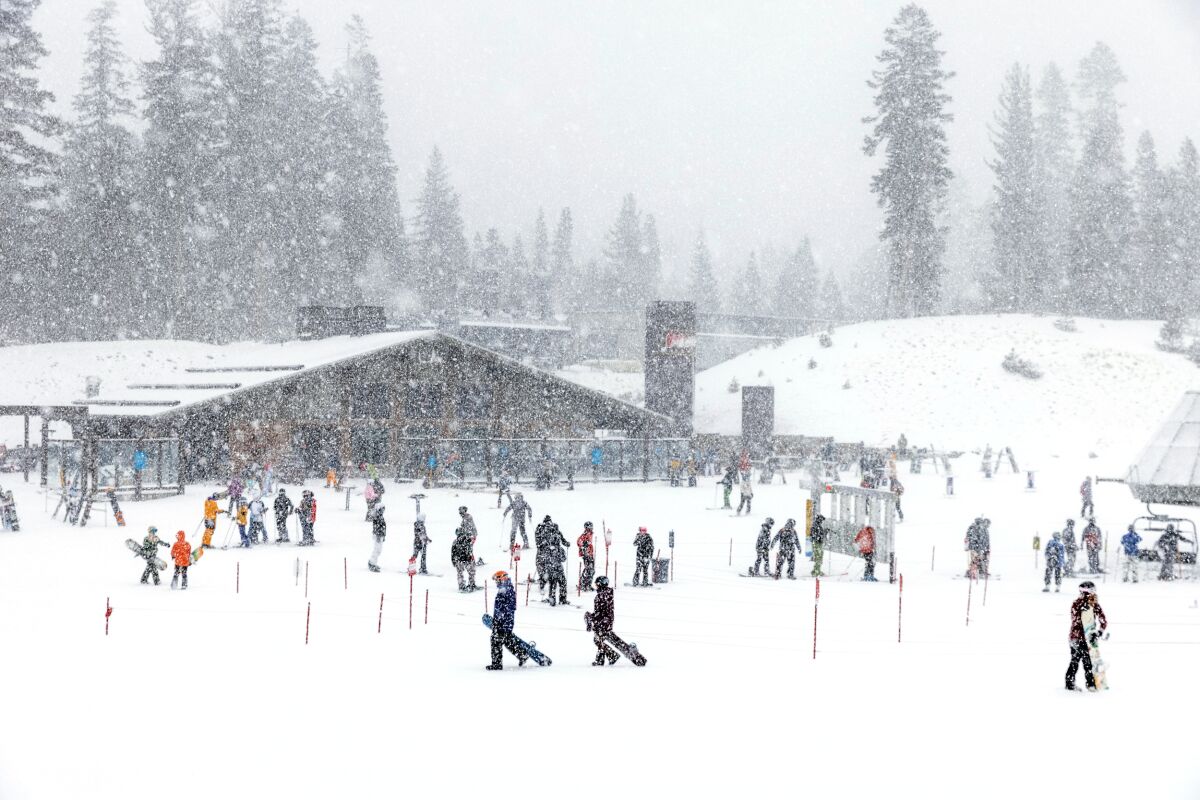 People play in the snow at Mammoth Mountain.