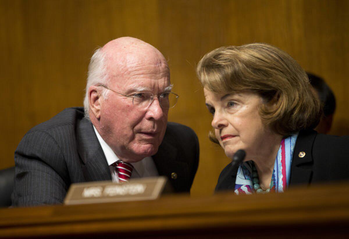 Senate Judiciary Committee Chairman Sen. Patrick Leahy (D-Vt.), left, talks with Sen. Dianne Feinstein, D-Calif., on Capitol Hill during the committee's oversight hearing on the Foreign Intelligence Surveillance Act.