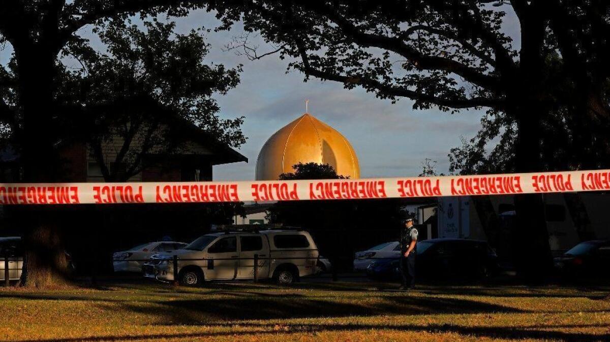 A police officer stands guard in front of Al Noor Mosque in Christchurch, New Zealand, the site of one of two mass shootings on March 15, 2019.