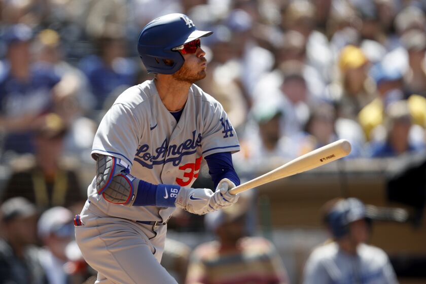 Los Angeles Dodgers' Cody Bellinger watches his three-run home run against the San Diego Padres during the fifth inning of a baseball game Sunday, April 24, 2022, in San Diego. (AP Photo/Mike McGinnis)