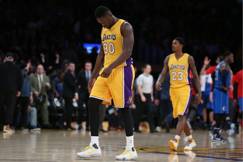 Julius Randle hangs his head after missing a three-point shot as time expired in the Lakers' 92-90 loss to the Mavericks at Staples Center on Jan. 26.
