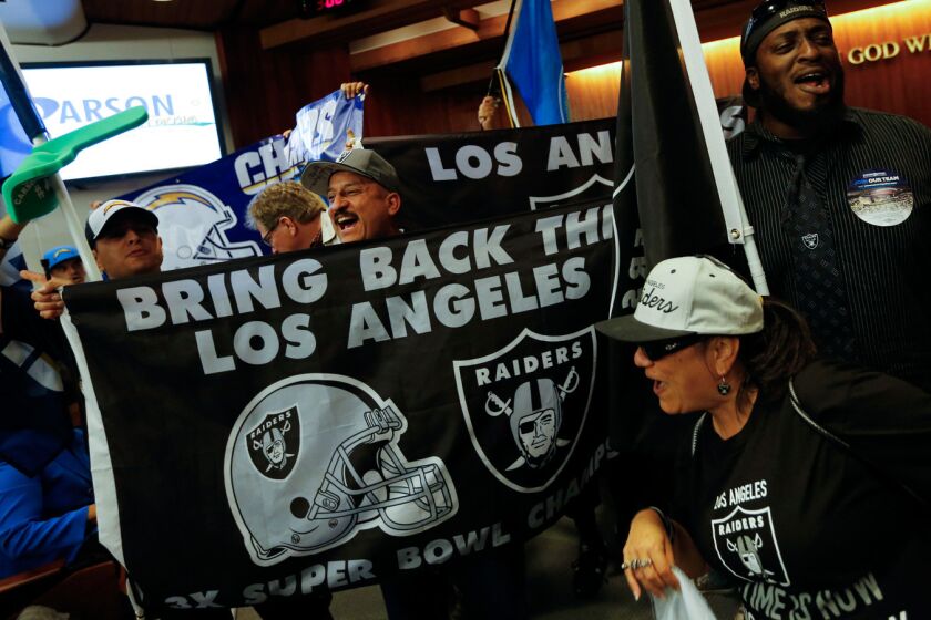Raiders and Chargers fans gather for a tailgate party and rally before marching to Carson City Hall on April 21 to show support for a plan to build an NFL stadium to house both NFL franchises.