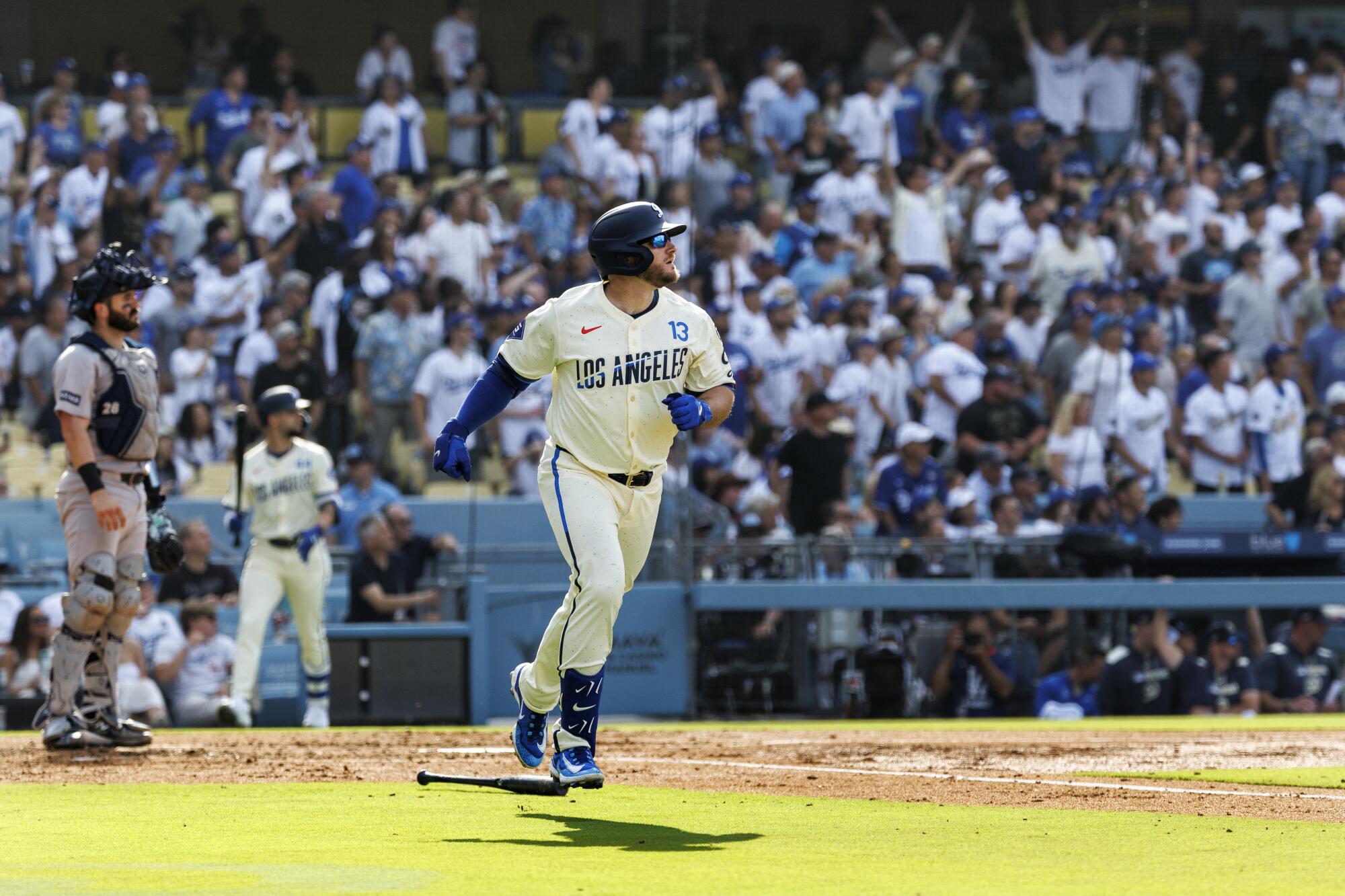 Max Muncy hits a three-run home run in the second inning for the Dodgers on Saturday.