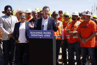 California Governor Gavin Newsom speaks during a press conference at the construction of the Battery Energy Storage Systems (BESS) for the future site of Proxima Solar Farm in Stanislaus County, Calif. Friday, May 19, 2023. California Gov. Gavin Newsom on Friday pledged to fast-track hundreds of billions of dollars' worth of construction projects throughout the state, including a pair of large water endeavors that have languished for years amid permitting delays and opposition from environmental groups. (John G. Mabanglo/Pool Photo via AP)